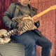 Illustration for article titled Well now: A man has turned his metalhead uncle's bones into a "Skelecaster" guitar